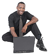 black_man_working_sitting_on_floor